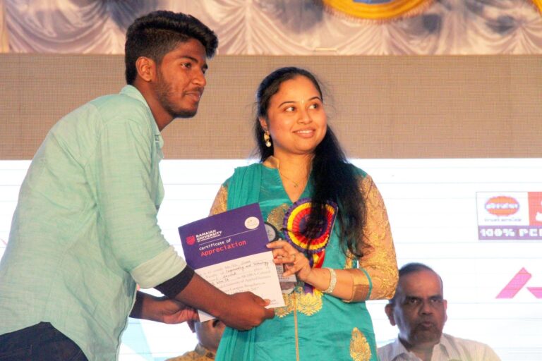 Priyadarshini distributing Certificate to Ramaiah Univeristy Student