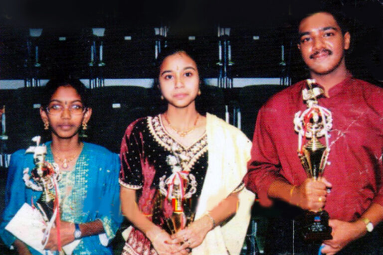 Priyadarshini receiving her Best Singer Award from ‘Oli 96.8’ Radio Corporation of Singapore in 2000